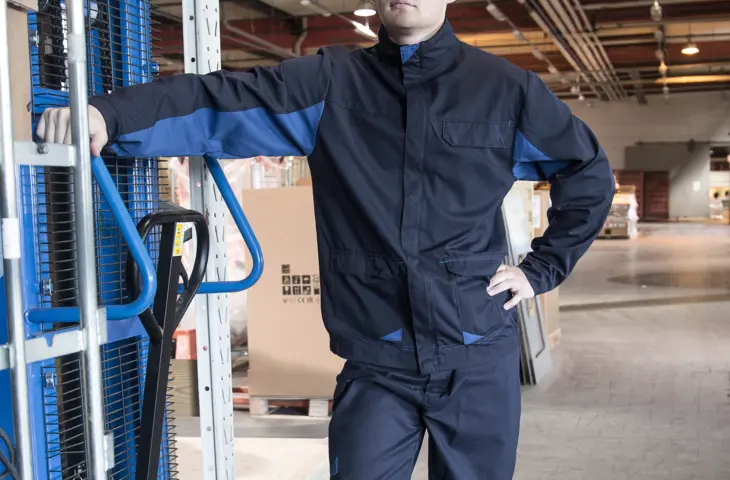 A man wearing an Epitech bomber jacket