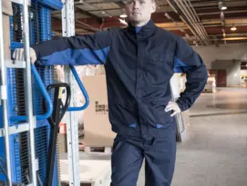 A man wearing an Epitech bomber jacket